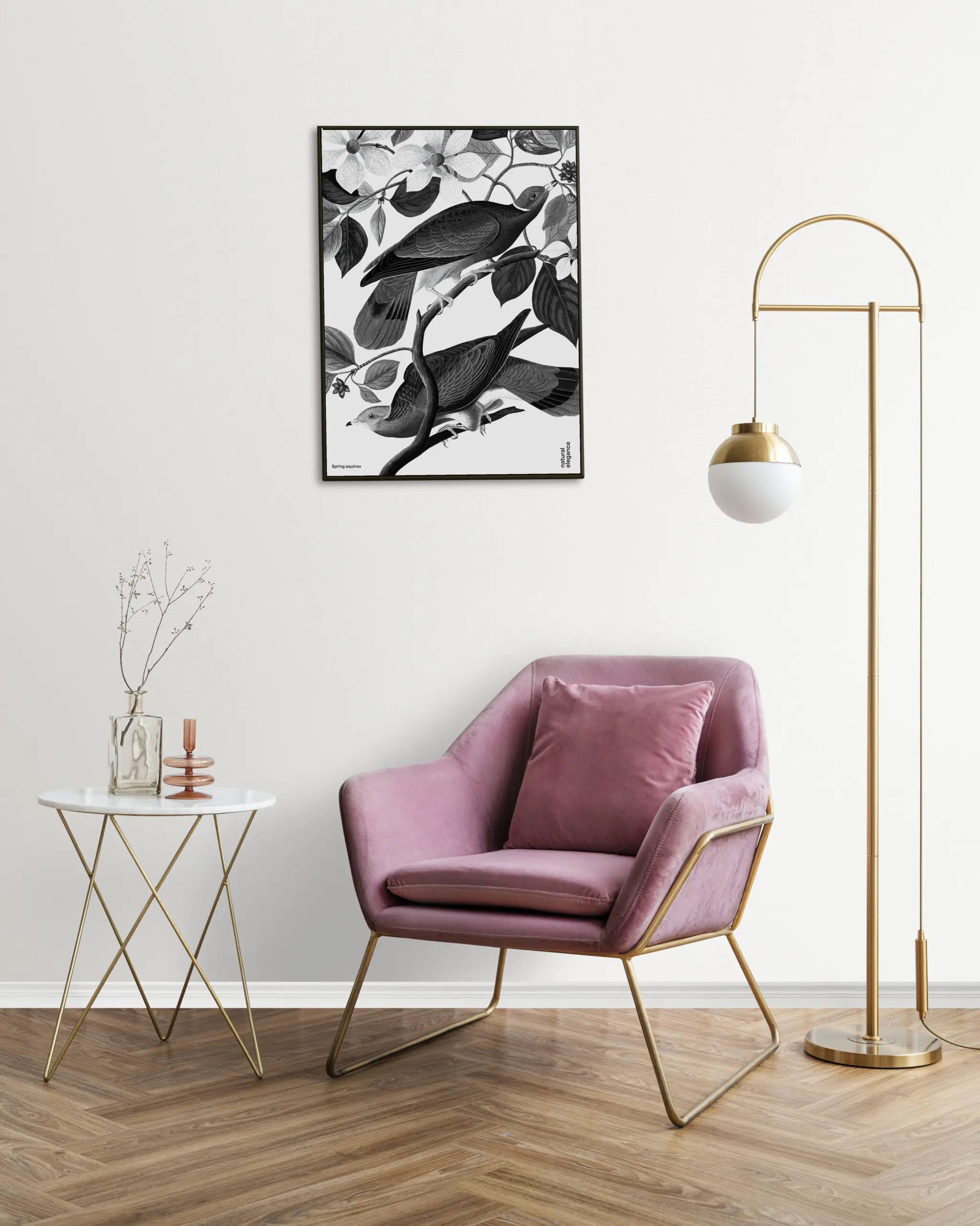 Picture frame with abstract art by a pink velvet armchair